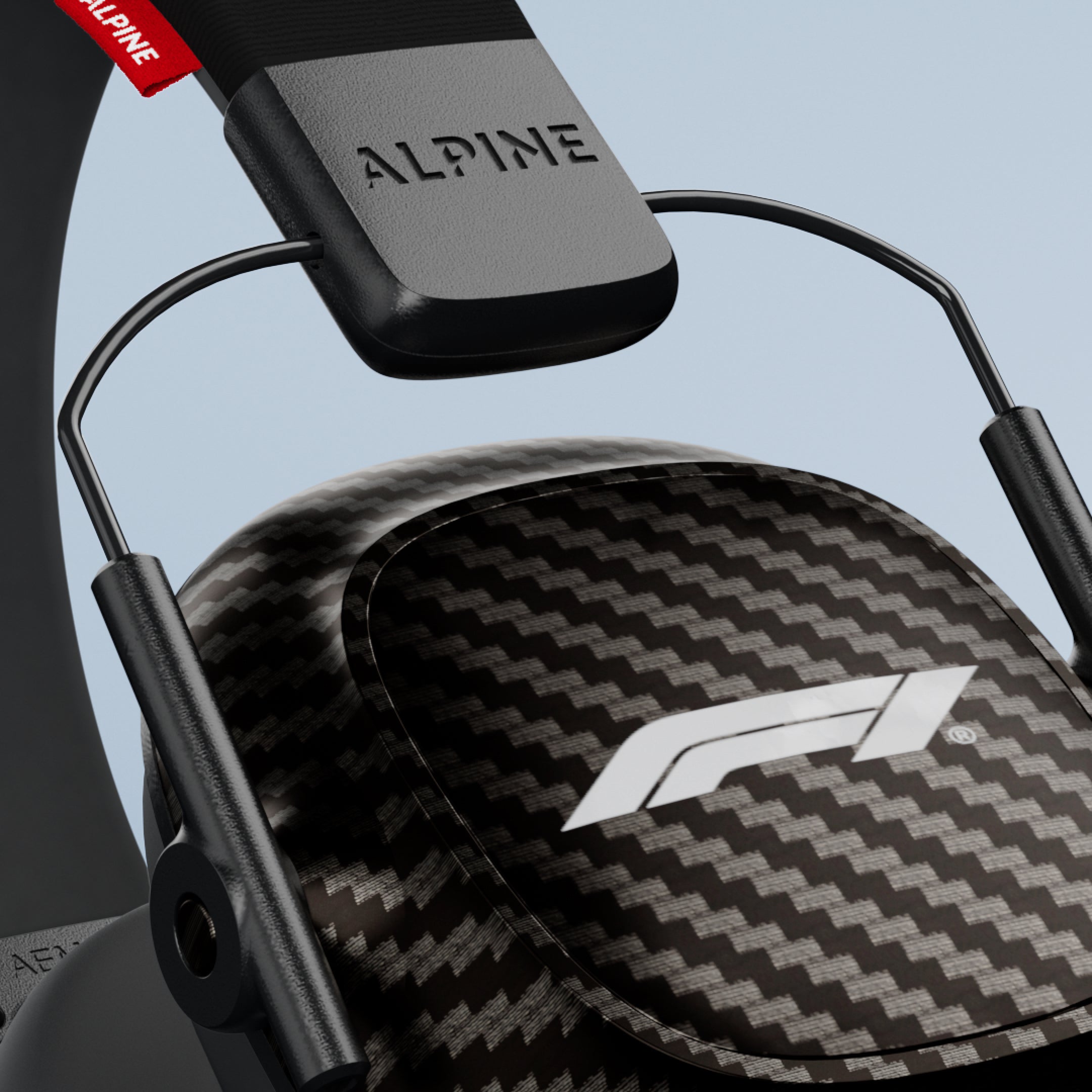Close-up of an Alpine Formula 1 Earmuffs ear cup with F1 logo and Alpine headband