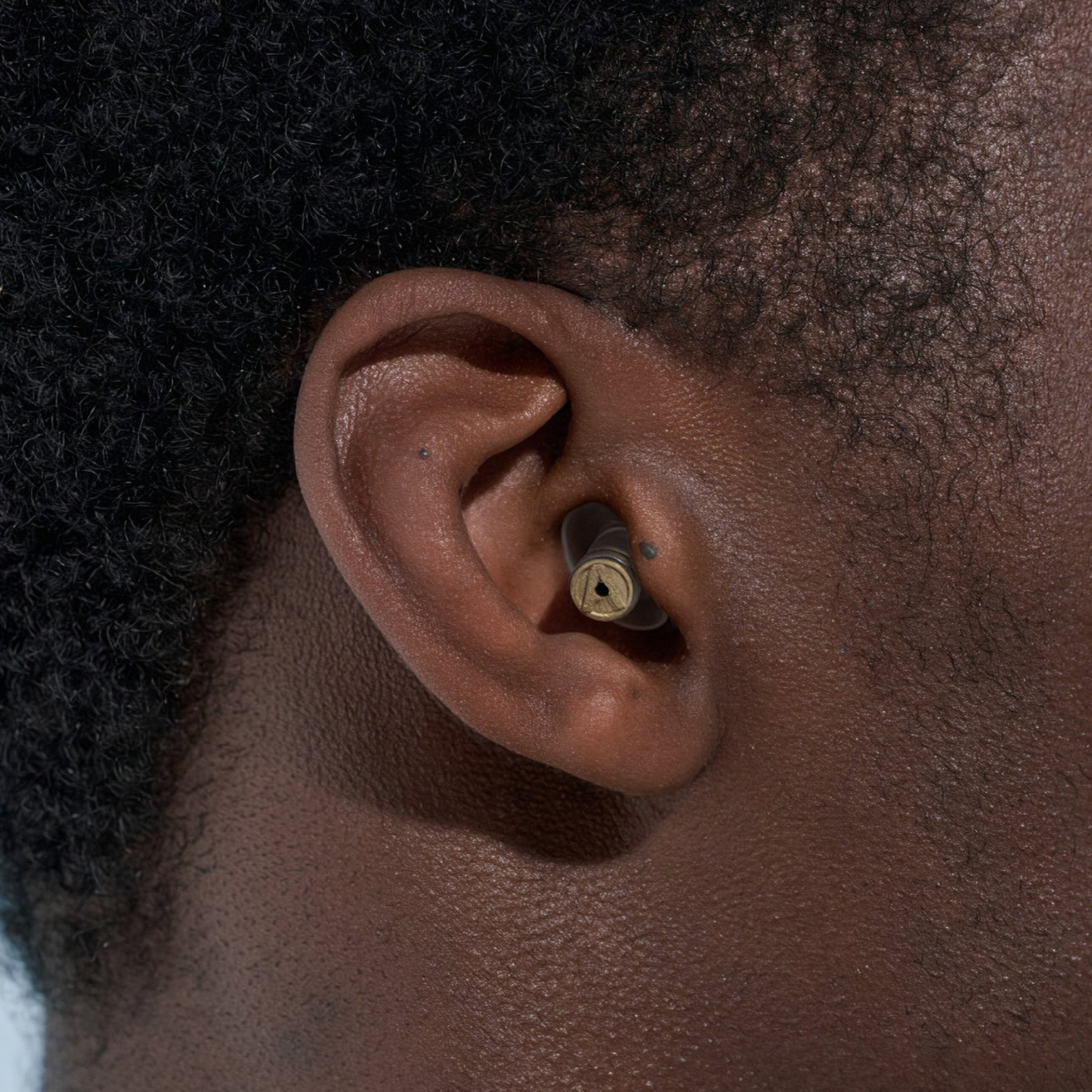 Close-up of an Alpine MusicSafe Pro earplug worn in a person&