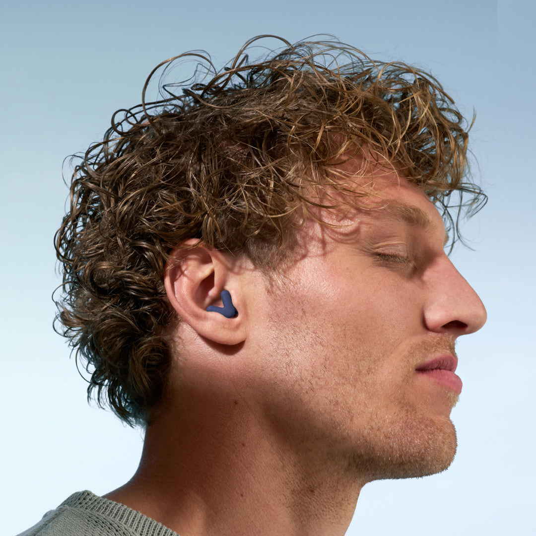 Guy wearing a midnight blue Alpine Silence