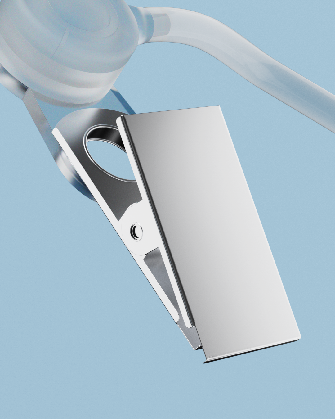 Close-up of the metal clothing clip on the clear acoustic tube of the Alpine Portofoon Custom 